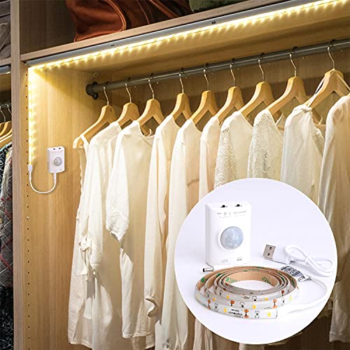 Aigostar - Tira LED de 1m con sensor de movimiento. Luz cálida 3000K, IP65 impermeable, batería recargable USB. Tira LED autoadhesiva, para dormitorios, salón, cocina, armarios y decoración.